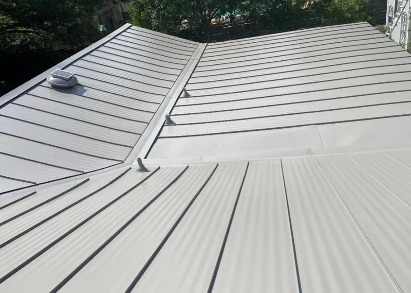 Solar attic fan installed on a metal roof for Roof Ventilation in Aiken